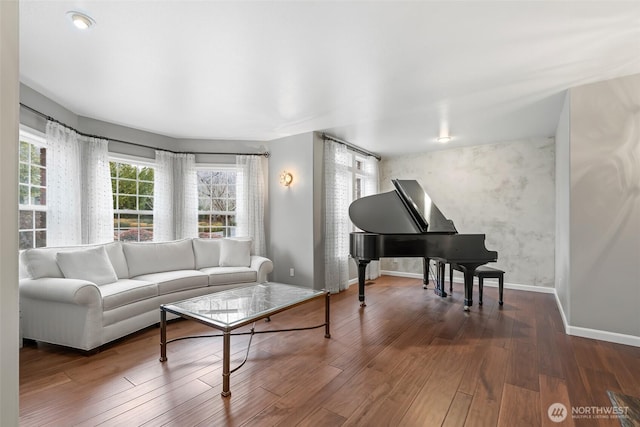 living room featuring baseboards and wood finished floors