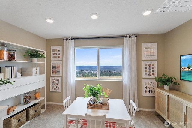 dining room featuring recessed lighting, visible vents, light carpet, and baseboards