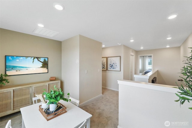 carpeted dining space with recessed lighting, visible vents, and baseboards