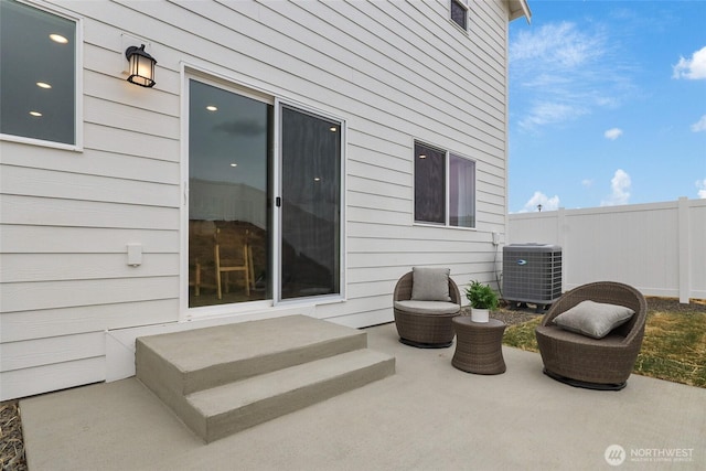 view of patio / terrace with fence and central AC