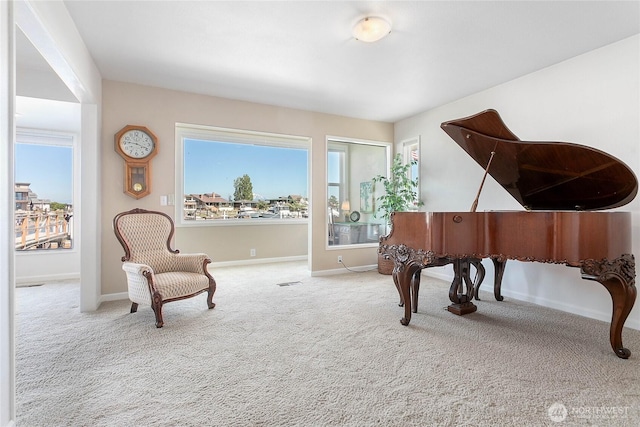 living area with carpet flooring and baseboards