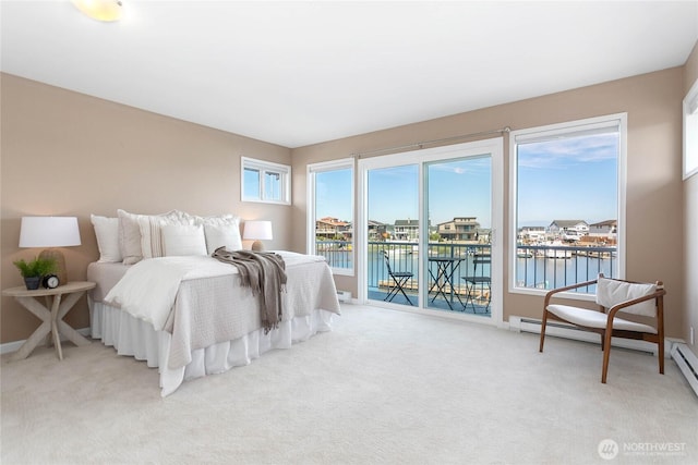 bedroom with baseboards, light colored carpet, a water view, access to exterior, and a baseboard heating unit