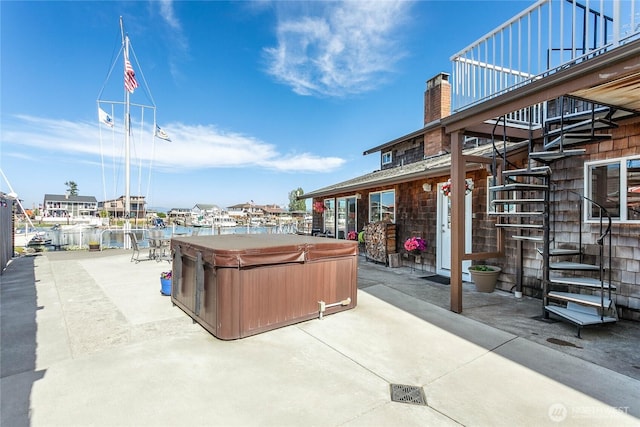 view of patio / terrace with a hot tub