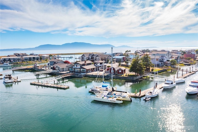 bird's eye view with a residential view and a water and mountain view