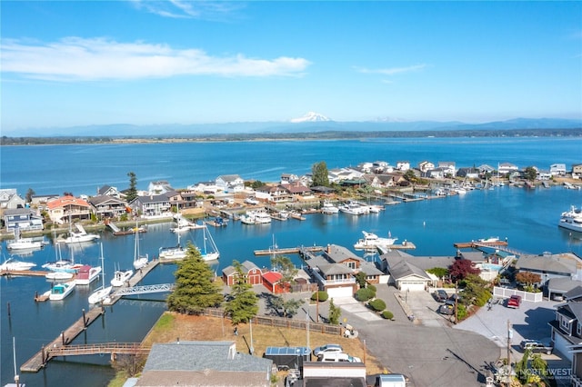 bird's eye view with a water and mountain view