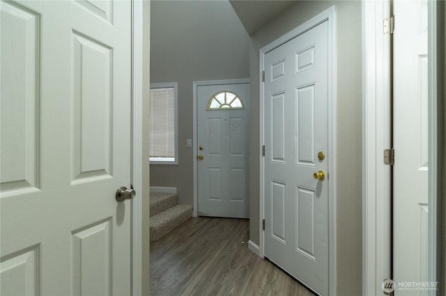 entrance foyer with stairway and light wood-type flooring