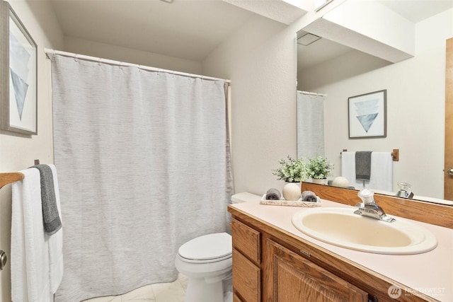 bathroom featuring vanity, toilet, and a shower with curtain