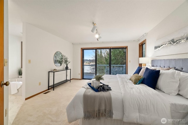 bedroom with baseboards, light carpet, visible vents, and access to exterior