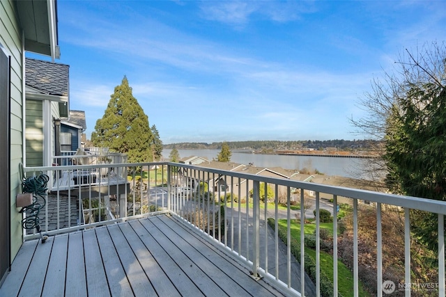 wooden deck with a water view