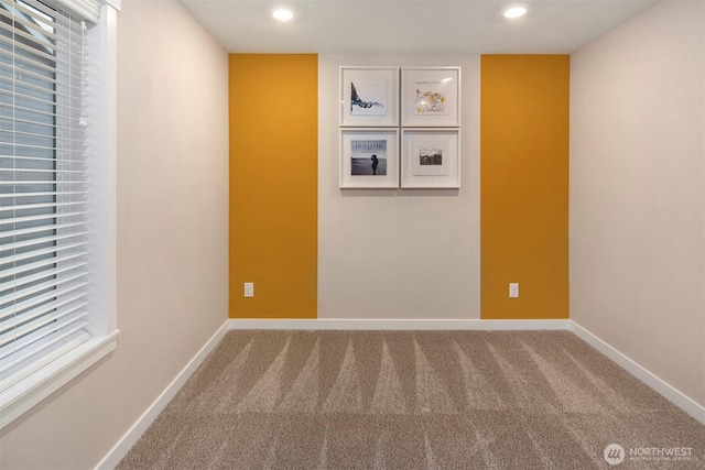 carpeted empty room with recessed lighting and baseboards