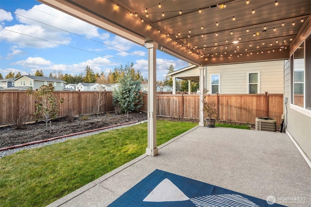 view of patio / terrace with cooling unit and a fenced backyard