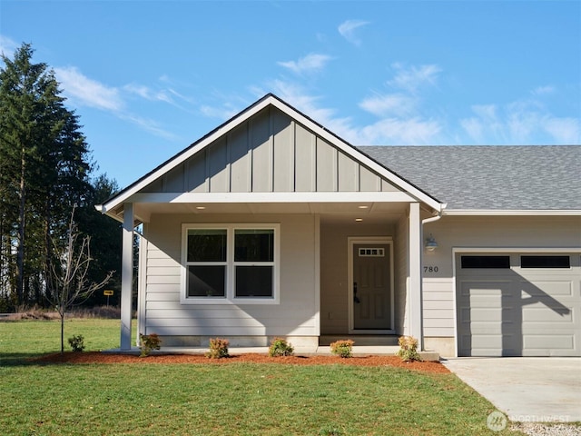 view of front of home featuring roof with shingles, an attached garage, board and batten siding, a front yard, and driveway