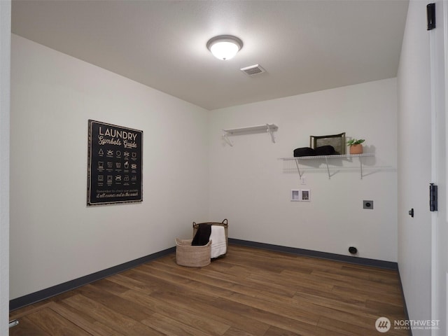 laundry area with washer hookup, hookup for an electric dryer, wood finished floors, laundry area, and baseboards