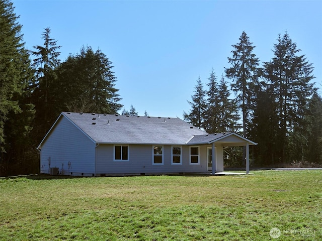 rear view of property featuring central air condition unit, crawl space, a patio area, and a yard