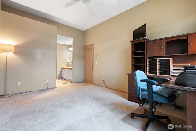 office space with light colored carpet and ceiling fan