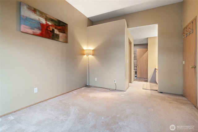 unfurnished bedroom with baseboards and carpet