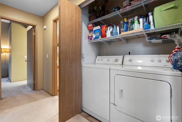 laundry room with laundry area, light colored carpet, and independent washer and dryer