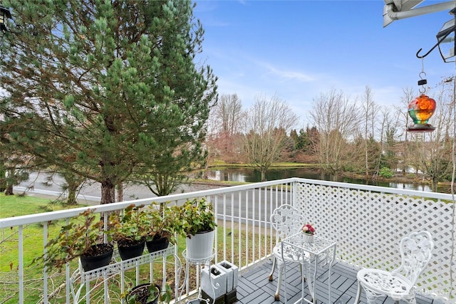 balcony featuring a water view