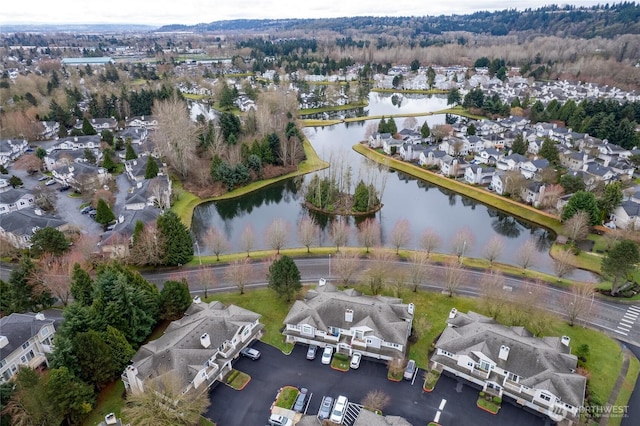 bird's eye view with a residential view and a water view