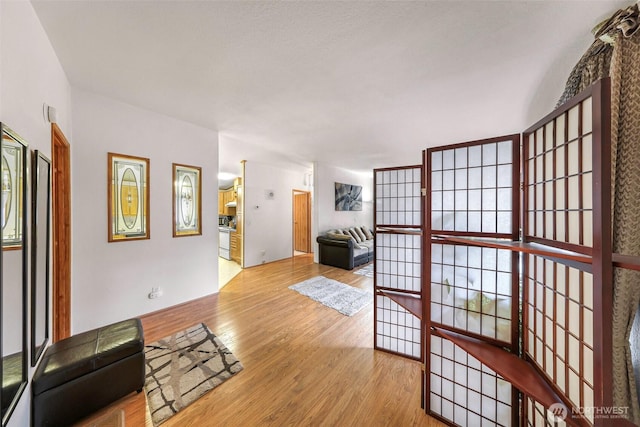 hall with wood finished floors