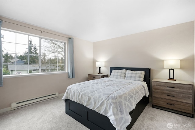 bedroom featuring baseboard heating and carpet flooring