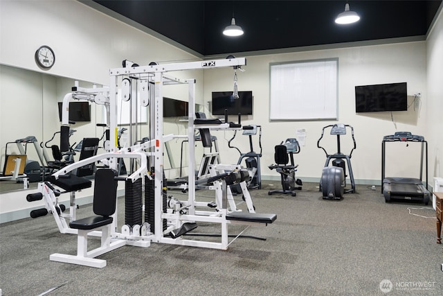 gym featuring baseboards