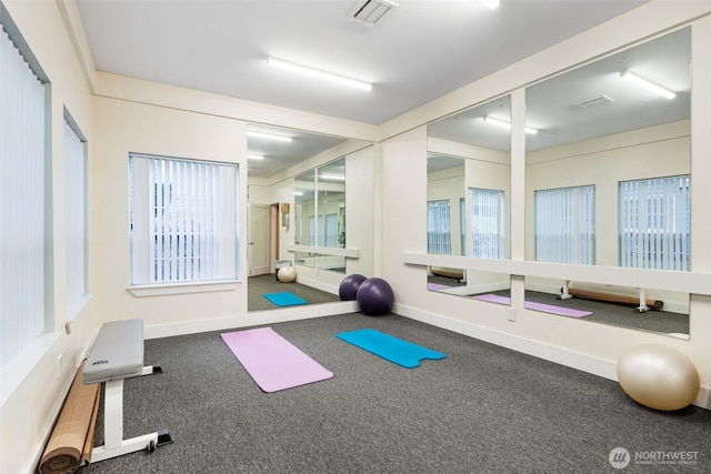 workout area featuring visible vents and baseboards