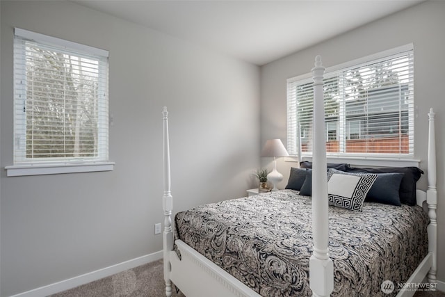 carpeted bedroom featuring baseboards