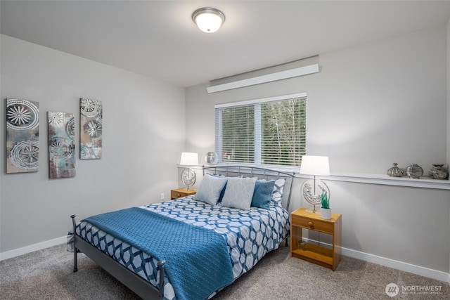 carpeted bedroom with baseboards