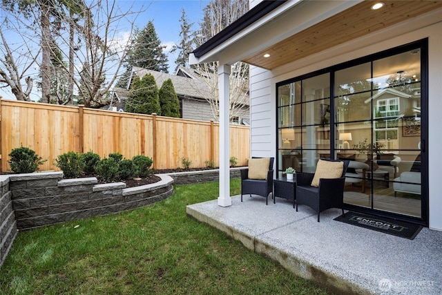 view of yard with fence and a patio