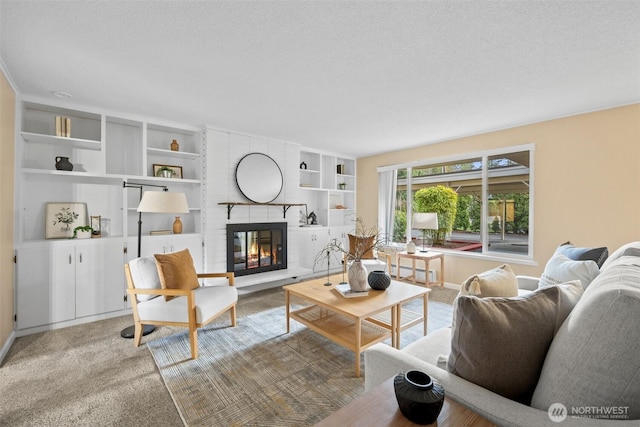 living room featuring a textured ceiling, carpet floors, and a brick fireplace