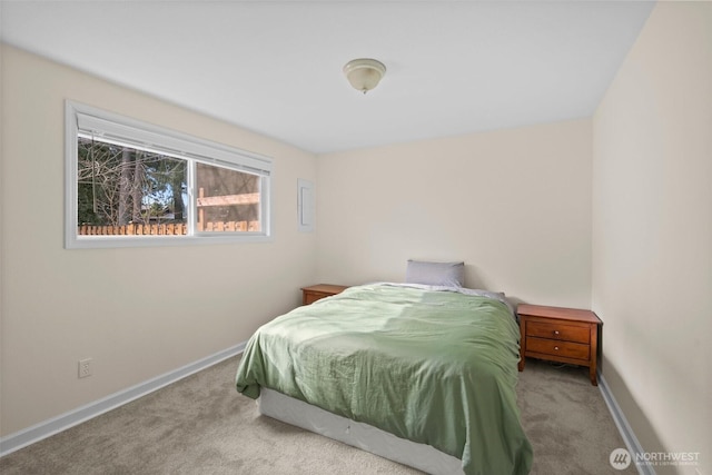 carpeted bedroom featuring baseboards