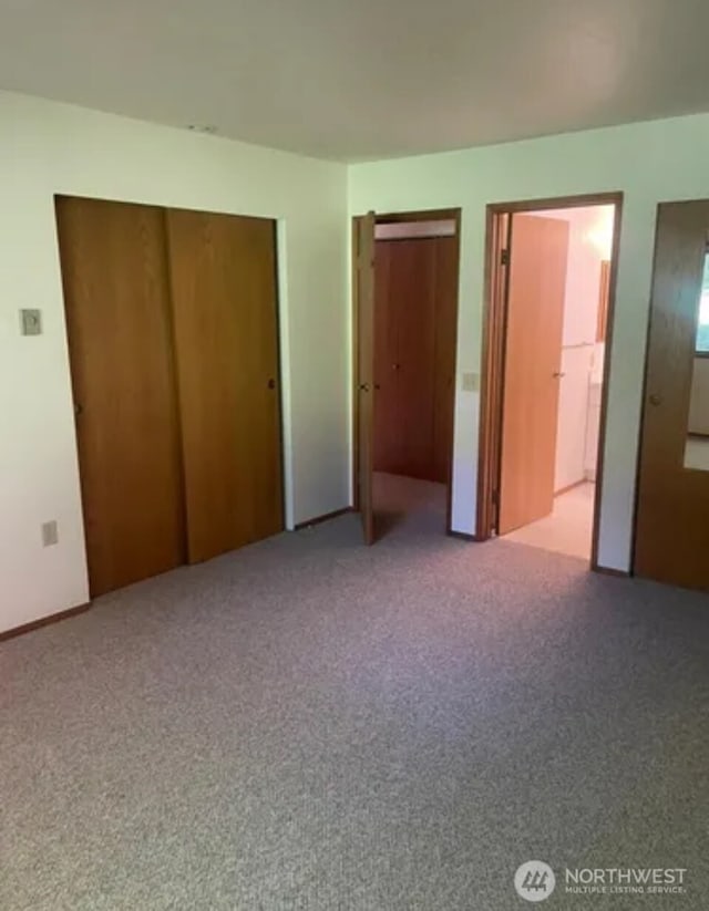 304 10th St, Kirkland, WA 98033 - unfurnished bedroom with carpet, multiple closets, and ensuite bath