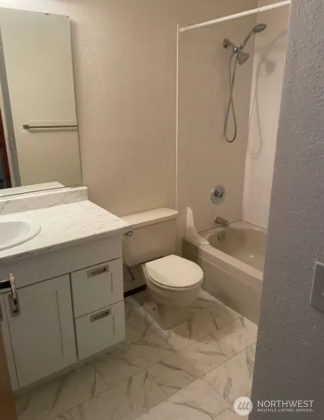 304 10th St, Kirkland, WA 98033 - bathroom featuring vanity, shower / bath combination, toilet, marble finish floor, and a textured wall