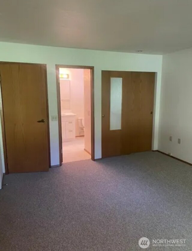 304 10th St, Kirkland, WA 98033 - unfurnished bedroom featuring ensuite bath and carpet floors