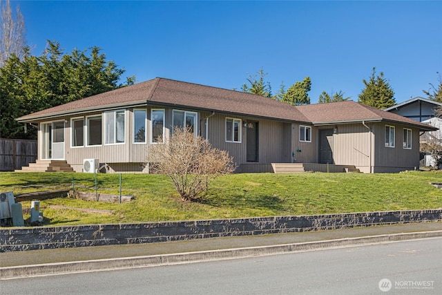 ranch-style home featuring entry steps and a front yard