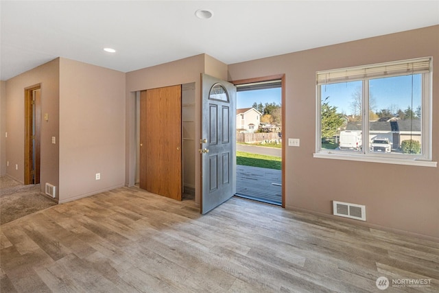 entryway featuring recessed lighting, visible vents, and wood finished floors