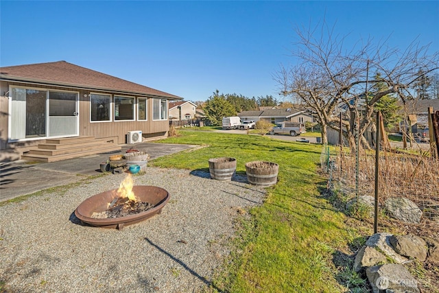 view of yard with a patio area and an outdoor fire pit