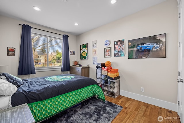 bedroom featuring recessed lighting, baseboards, and wood finished floors