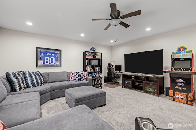 carpeted living area with a ceiling fan and recessed lighting