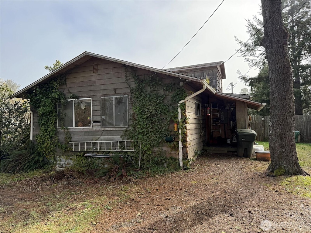 view of property exterior with fence