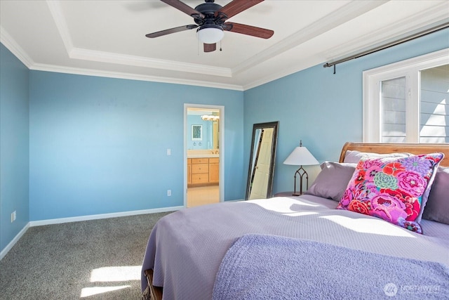 bedroom with carpet floors, ornamental molding, a raised ceiling, and baseboards