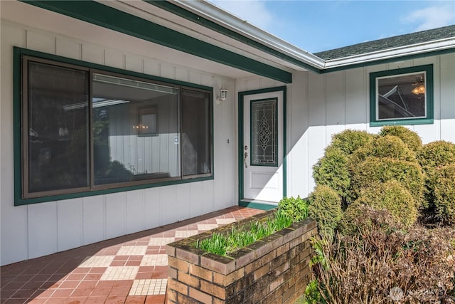 doorway to property featuring board and batten siding