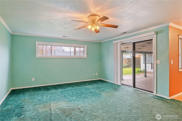 unfurnished room featuring carpet, visible vents, crown molding, and baseboards