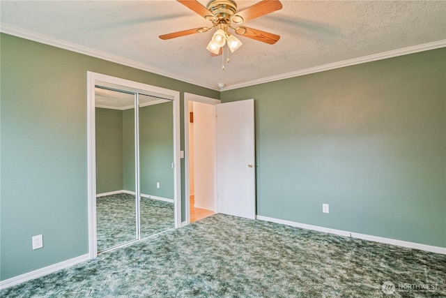 unfurnished bedroom featuring ornamental molding, a closet, carpet floors, and a textured ceiling