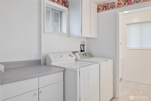 washroom with light floors, separate washer and dryer, cabinet space, and baseboards