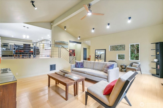 living room with wood finished floors, visible vents, high vaulted ceiling, beam ceiling, and ceiling fan