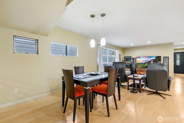 dining room featuring recessed lighting, light wood-type flooring, and baseboards