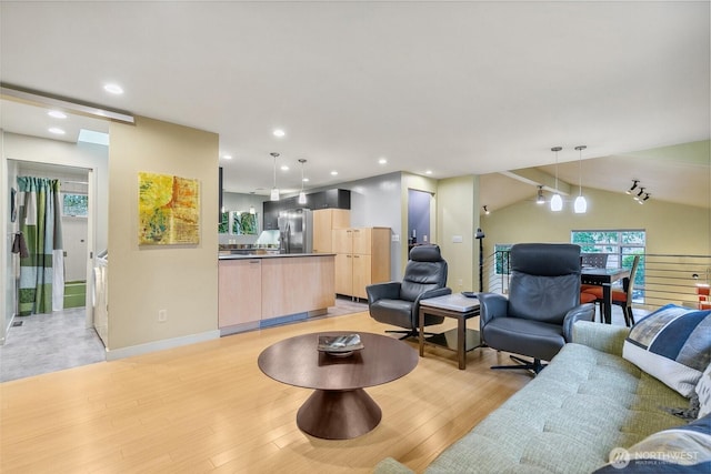 living area with lofted ceiling, recessed lighting, light wood-type flooring, and baseboards