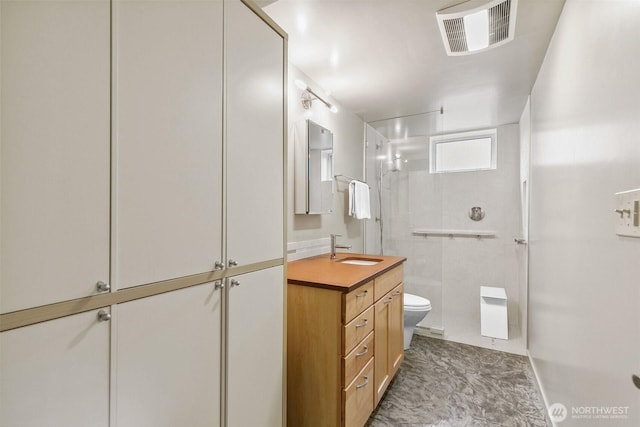 full bathroom with visible vents, toilet, vanity, and walk in shower